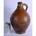 A LARGE 18TH CENTURY EUROPEAN STONEWARE BELLARMINE JUG decorated with mask heads. 36 cm x 18 cm.