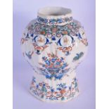 AN 18TH CENTURY DELFT FAIENCE TYPE TIN GLAZED VASE painted with birds and insects. 20 cm x 10 cm.