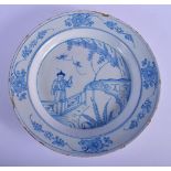 A LARGE 18TH CENTURY DELFT BLUE AND WHITE TIN GLAZED POTTERY DISH painted with a Chinese figure in a