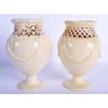 A PAIR OF LATE 18TH CENTURY LEEDS CREAMWARE RETICULATED VASES with moulded overlaid swags and vines.