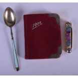 A LATE 19TH CENTURY SILVER AND LEATHER BOOK together with a silver spoon etc. Largest 9 cm long. (3)