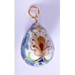 A CONTINENTAL SILVER AND ENAMEL EGG PENDANT. 3.5cm long, weight 8g