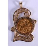 A GOLD SOVEREIGN PENDANT IN THE SHAPE OF A POUND SIGN. Size 5.3cm x 3.2cm, weight 13.18g