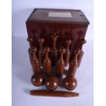 A VERY UNUSUAL LATE VICTORIAN CARVED HARDWOOD SKITTLE SET within original fitted box. 33 cm x 29 cm.