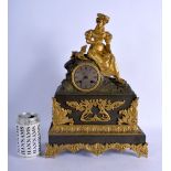 A 19TH CENTURY FRENCH GILT BRONZE MANTEL CLOCK formed as a seated female beside a dog. 38 cm x 24 cm