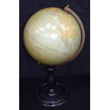 A Belgian Berzbach and Falk antique globe mounted on a wooden stand and brass mounts 52 x 28cm