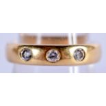 AN ANTIQUE 18CT GOLD RING SET WITH 3 DIAMONDS. Size Q, weight 9.27g