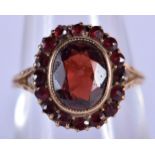 A 9CT GOLD AND GARNET RING. Size N, weight 2.49g