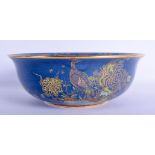 A LARGE ART DECO CARLTON WARE PORCELAIN BOWL enamelled with birds and foliage. 25 cm diameter.