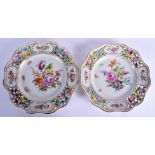 A PAIR OF EARLY 20TH CENTURY DRESDEN RETICULATED PORCELAIN PLATES painted with flowers. 26 cm wide.