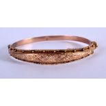 A 9CT GOLD BANGLE. Internal size 5.7cm x 5cm, weight 6.93g, hallmarked Birmingham