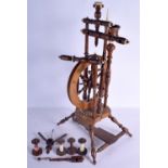 AN ANTIQUE SPINNING WHEEL with bobbins. 67 cm high.