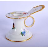 AN ANTIQUE MEISSEN PORCELAIN CHAMBERSTICK painted with flowers. 8.5 cm wide.
