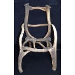 A vintage stag antler child's chair 42 x 37 x 30cm.