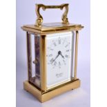 A MODERN WOODFORD CARRIAGE CLOCK. 17 cm high inc handle.