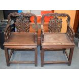 A PAIR OF 19TH CENTURY CHINESE CARVED HARDWOOD ARMCHAIRS decorated with bats and foliage. 100 cm x 5