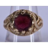 A 9CT GOLD AND GARNET RING. Size Q, weight 7.44g