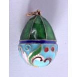A CONTINENTAL SILVER AND ENAMEL EGG PENDANT. 2.5cm long, weight 6g
