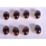 AN ANTIQUE SET OF EIGHT GOLD AND GARNET STUDS. Stud 1.3cm x 0.9cm, weight 11g (8)