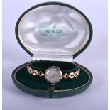 A BOXED 9CT GOLD LADIES WRISTWATCH. 17 grams overall. Dial 2 cm wide, strap 19 cm long.