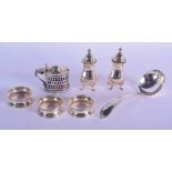 AN ANTIQUE SILVER SALT together with a pair of silver condiments etc. Silver 150 grams. (7)