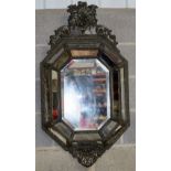 A gilt metal Baroque style mirror . 111 x 58cm.