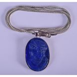 A 14CTWHITE GOLD AND LAPIS PENDANT. Pendent 2.4cm x 1.8cm, chain 46cm long