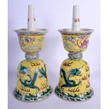 A PAIR OF 19TH CENTURY CHINESE FAMILLE JAUNE PRICKET CANDLESTICKS Guangxu, painted with dragons and