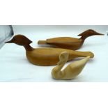 A Cherry wood carving of a bird by Norman wood together with a walnut bird and another. 50cm (3)