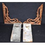 A pair of vintage brass penny slot Cero toilet door locks together with two ornate cast iron shelf b