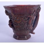 A CHINESE BUFFALO HORN TYPE LIBATION CUP 20th Century, overlaid with chilong. 12 cm x 14 cm.