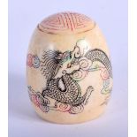 AN ANTIQUE CHINESE IVORY DOME SHAPED DESK SEAL DECORATED WITH A DRAGON IN THE CLOUDS. 4cm high, 3.3c