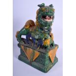 A LATE 19TH CENTURY CHINESE SANCAI GLAZED TERRACOTTA BUDDHISTIC LION Late Qing. 27 cm x 18 cm.