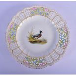 AN ANTIQUE MEISSEN RETICULATED PORCELAIN DISH painted with a duck. 24.5 cm diameter.