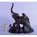 A LARGE 19TH CENTURY JAPANESE MEIJI PERIOD BRONZE OKIMONO modelled being attacked by a tiger. 37 cm