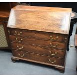 A LARGE GEORGE III COUNTRY HOUSE WRITING BUREAU with fitted interior and pull out drawers. 98 cm x 1