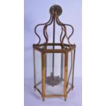 AN ART NOUVEAU DESIGN VINTAGE BRASS GLASS LANTERN of scrolling form. 52 cm x 18 cm.