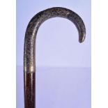 A 19TH CENTURY RUSSIAN SILVER NIELLO CARVED WOOD WALKING CANE decorated with foliage. 90 cm long.