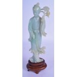 AN EARLY 20TH CENTURY CHINESE CARVED ICEY JADEITE FIGURE OF AN IMMORTAL Late Qing/Republic, modelled