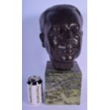 AN ART DECO BRITISH BRONZE BUST OF A MALE modelled upon a green marble base. 42 cm x 16 cm.