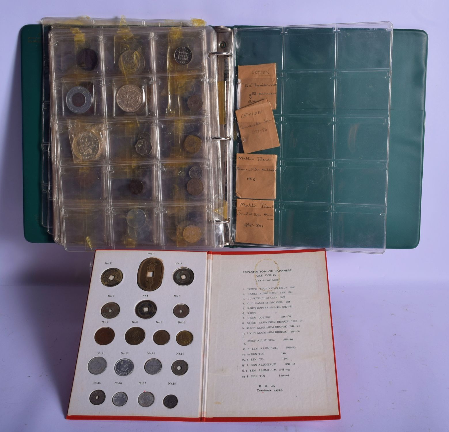 A PROOF SET OF JAPANESE COINS K C Co Yokohama Japan, together with a book of coins. (qty)