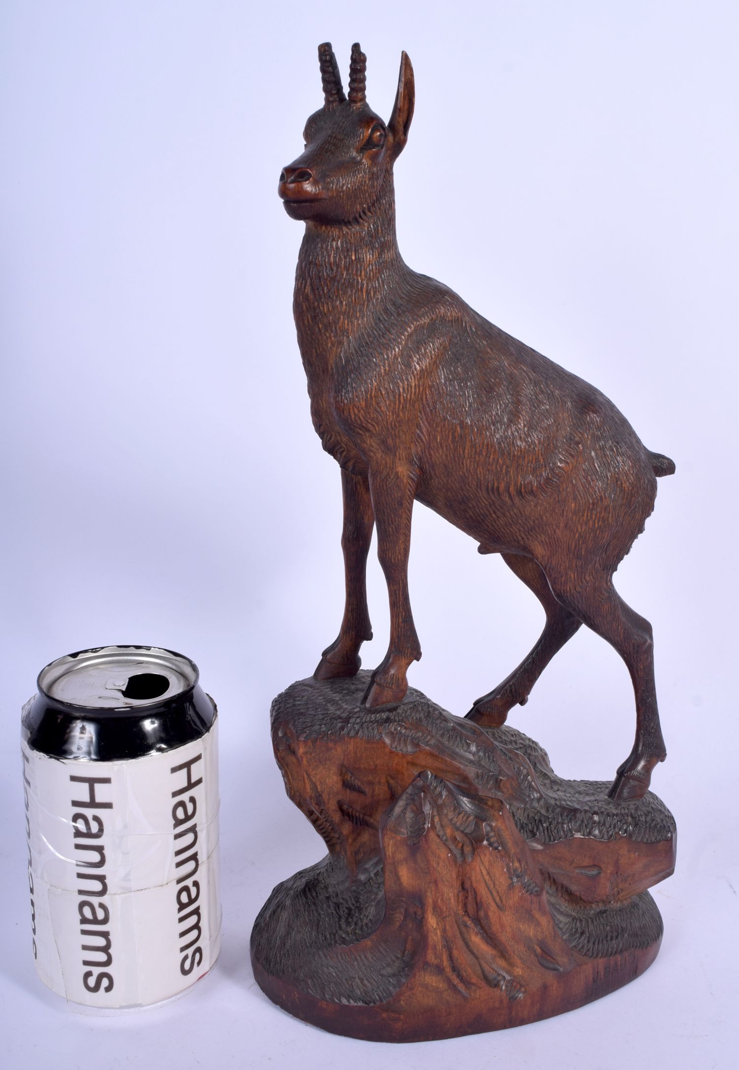 A 19TH CENTURY BAVARIAN BLACK FOREST FIGURE OF A MOUNTAIN GOAT by J Baud, modelled upon a naturalist