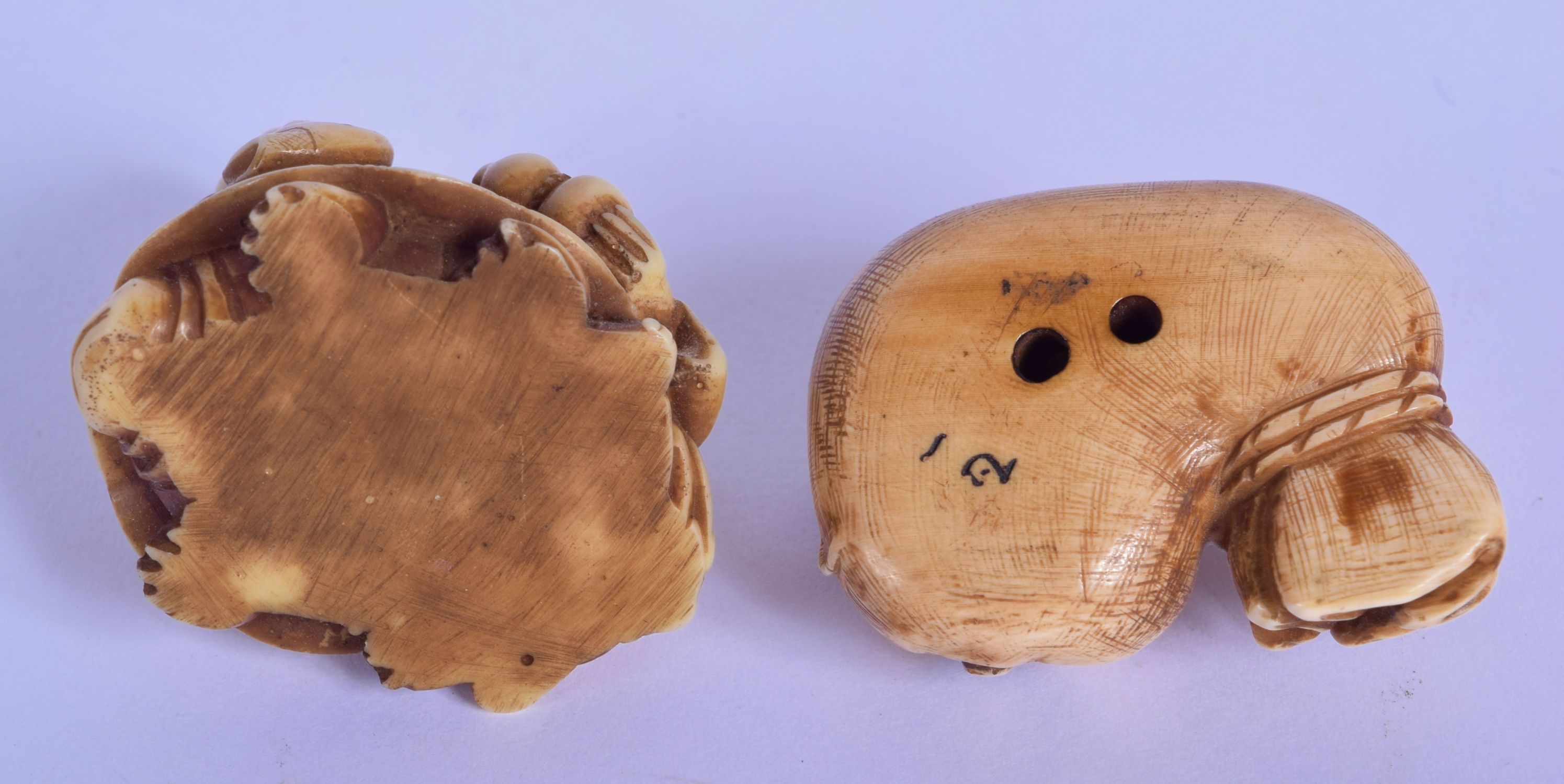 AN 18TH/19TH CENTURY JAPANESE EDO PERIOD CARVED STAG ANTLER MANJU NETSUKE together with a stone nets - Image 3 of 19
