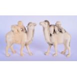 A PAIR OF 19TH CENTURY CHINESE CARVED IVORY FIGURES OF CAMELS modelled with attendants. 9 cm x 6 cm.