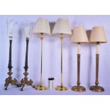 A LARGE PAIR OF 19TH CENTURY FRENCH BRONZE CANDLESTICK LAMPS together with four other brass lamps. L