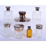 FIVE ANTIQUE SILVER TOPPED DRESSING TABLE JARS together with a silver inkwell and scent bottle. 1318