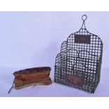 A VINTAGE MIXED METAL LETTER RACK together with a small folk art boat. Largest 30 cm x 15 cm. (2)