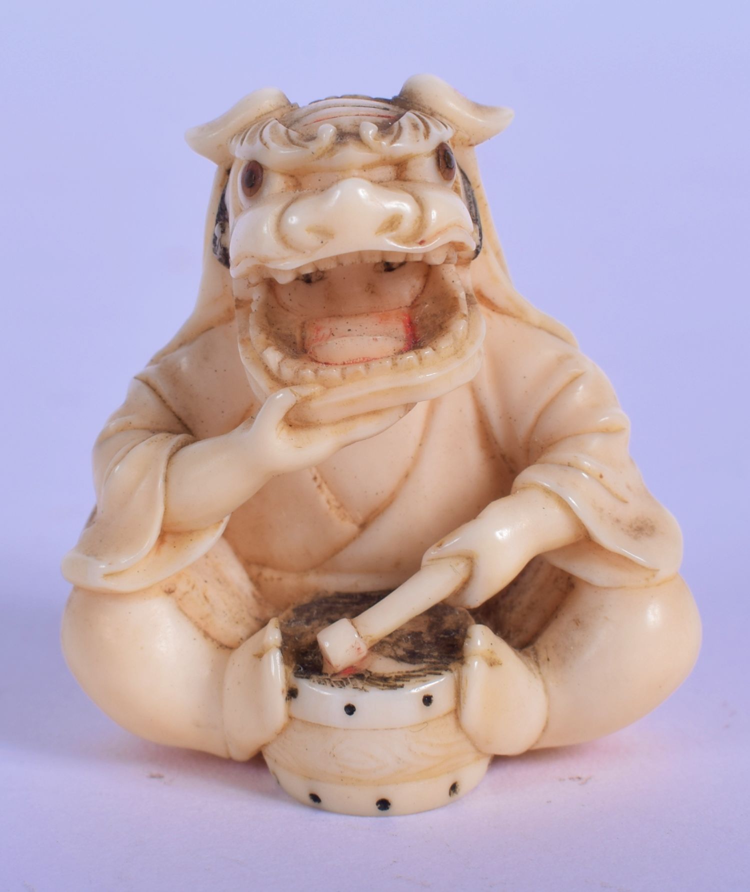 A LOVELY 19TH CENTURY JAPANESE MEIJI PERIOD CARVED IVORY NETSUKE modelled as a seated boy wearing a