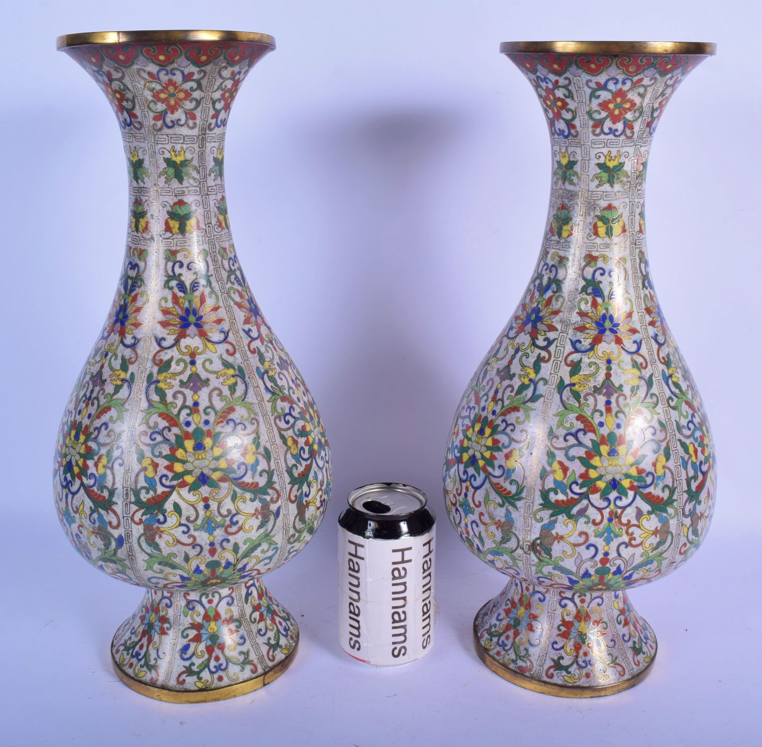 A LARGE PAIR OF EARLY 19TH CENTURY CHINESE CLOISONNE ENAMEL VASES Qing, decorated with foliage and a