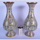 A LARGE PAIR OF EARLY 19TH CENTURY CHINESE CLOISONNE ENAMEL VASES Qing, decorated with foliage and a